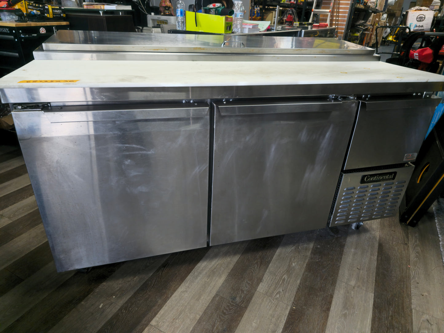 Continental Refrigerator PA68N 68" Pizza Prep Table with Two Full Doors and One Half Door